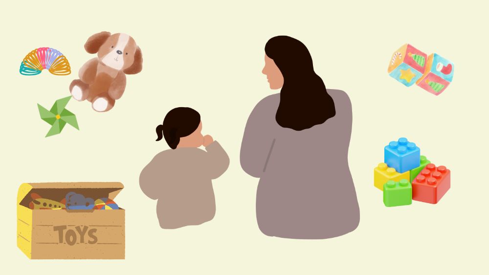 散らかった部屋で子供の話を聞くお母さん